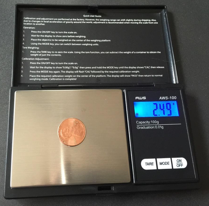 How do you calibrate a scale that measures weight in grams?